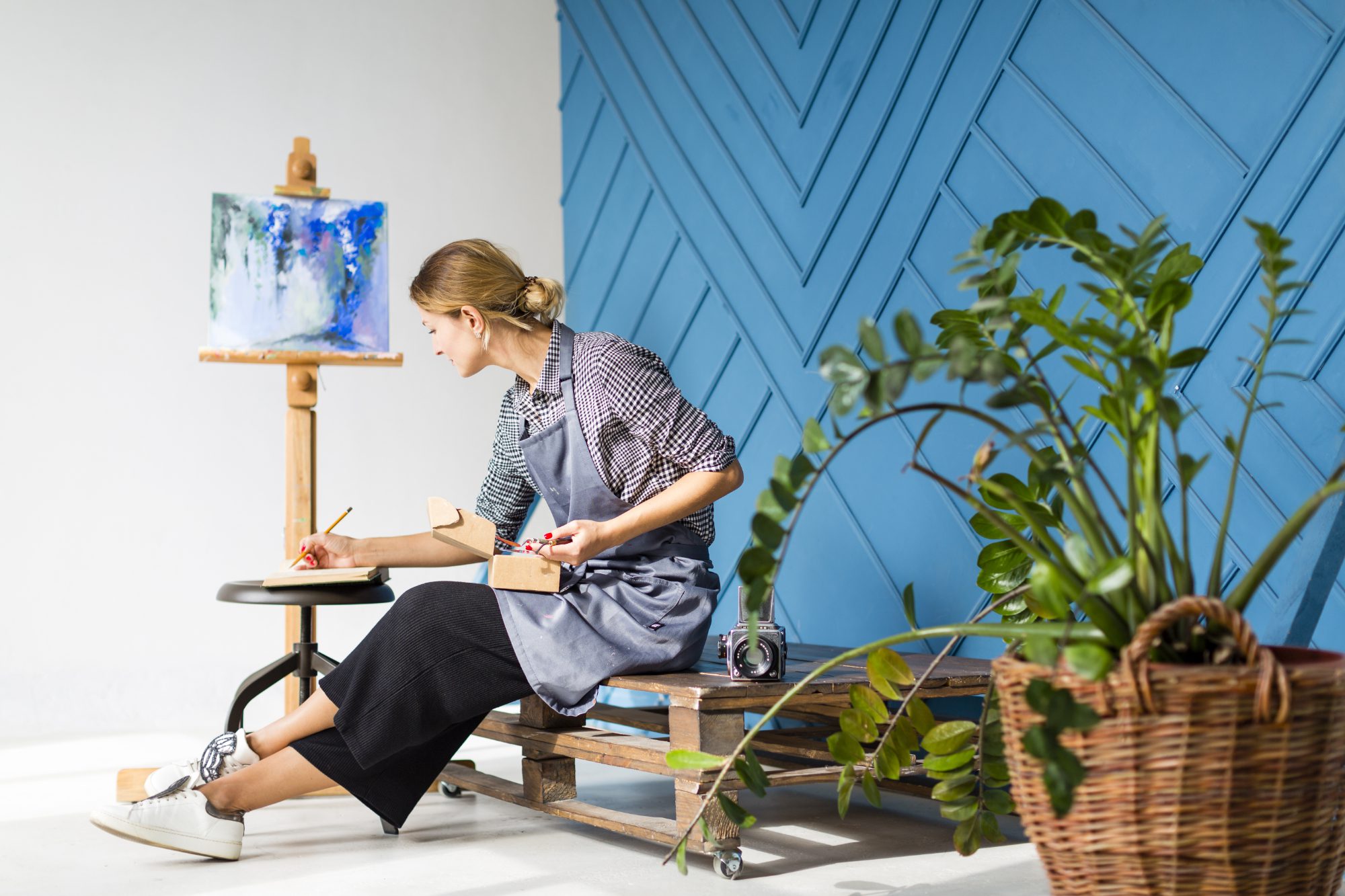side view woman writing painting